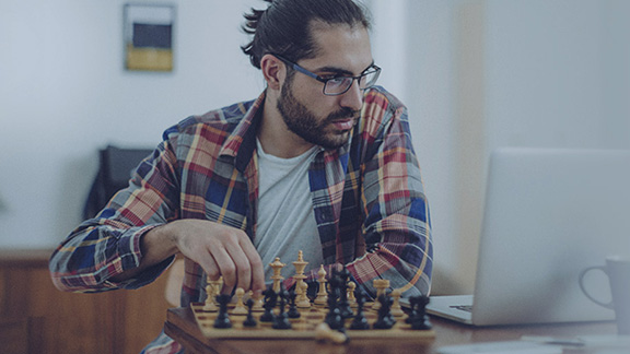 Man sitting at a chessboard