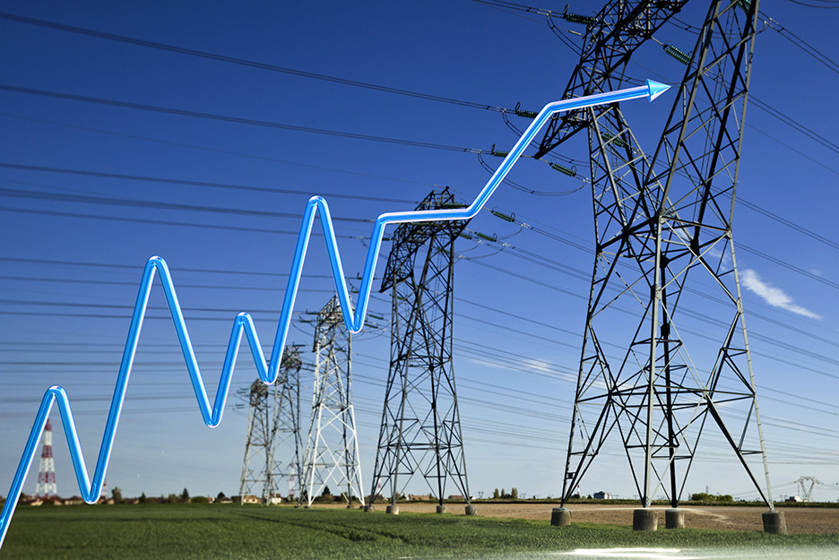 High-voltage pylons with graphic for rising price curve in the foreground.