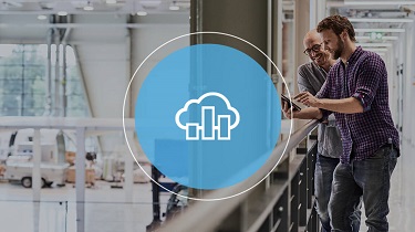Two men standing in factory building at railing plus light blue icon with cloud and diagram