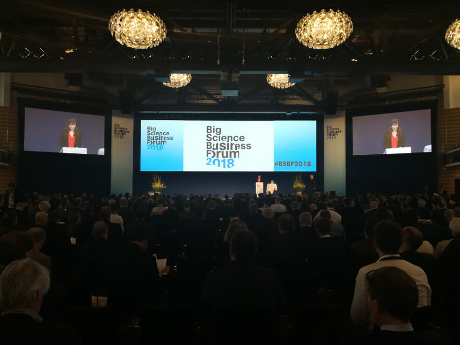 Full room with an audience for a keynote at the Big Science Business Forum