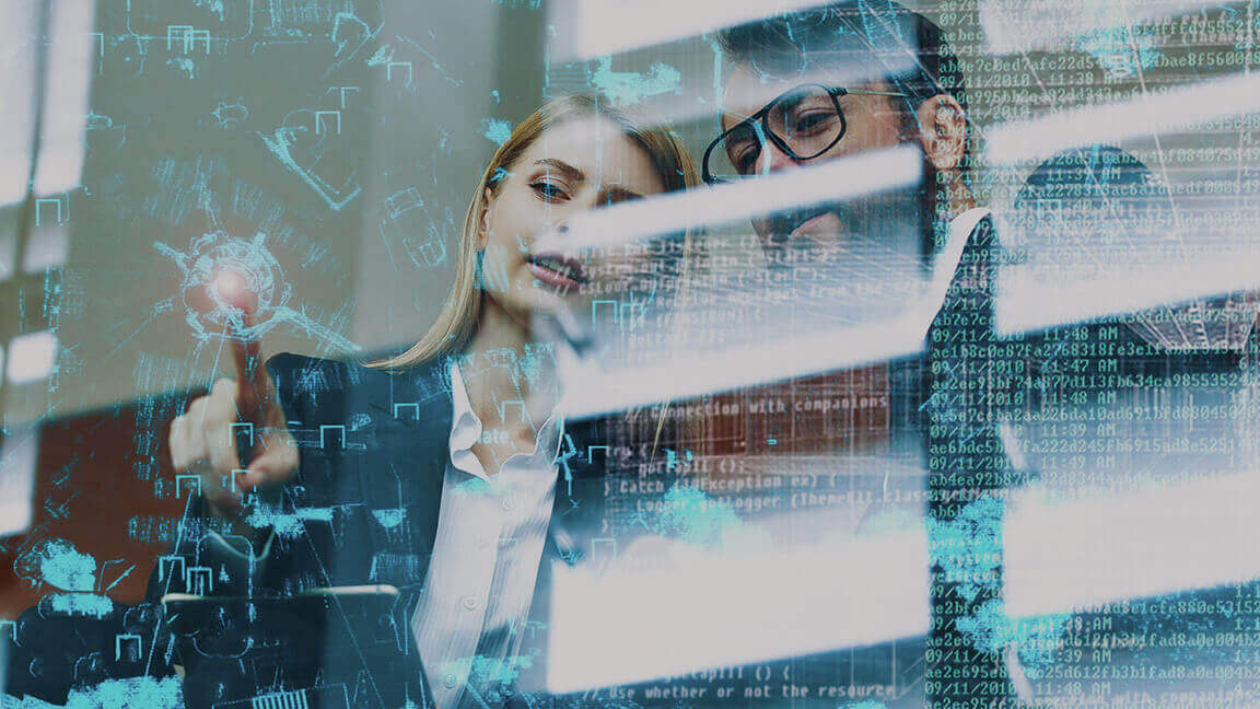 Man and woman in front of transparent screen