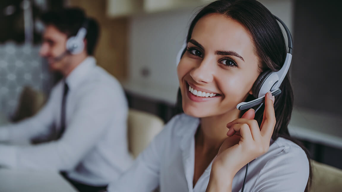 Woman with headset in call center