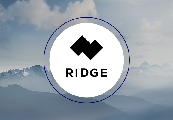 Ridge logo with a cloudy mountain range in the background.