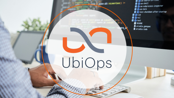 Ubiops logo with a man coding in the background.
