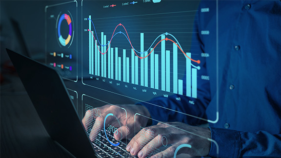 Image of 2 hands on a laptop keyboard and representation of a bar chart